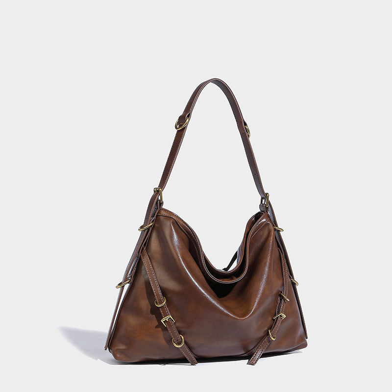 In Orderly Fashion designer shoulder handbag with structured silhouette and stylish handles, showcasing elegant bag design.