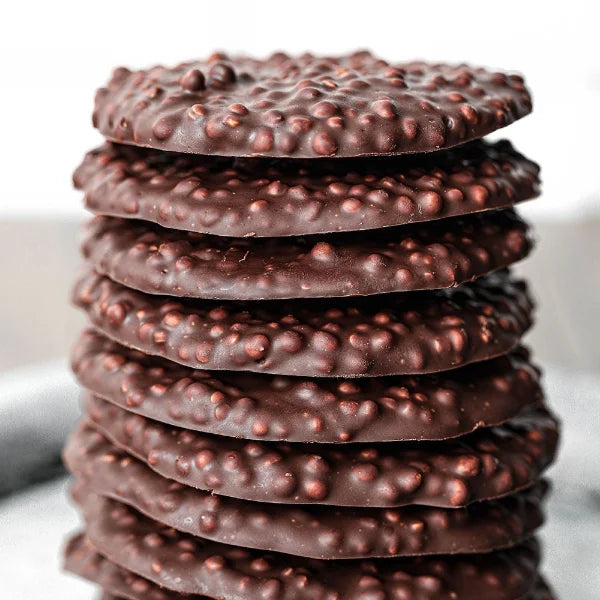 Vegan Fndly Chocolate Quinoa Bites recipe image showing bite-sized chocolate and quinoa treats on a plate with a fork.