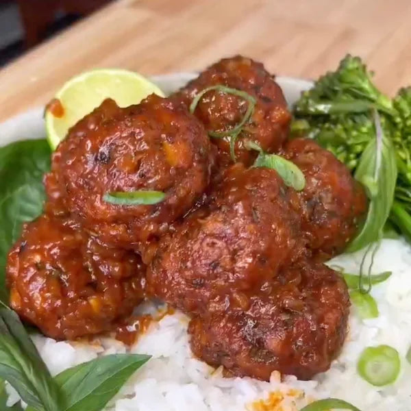Vegan Lemongrass Tofu Meatballs served on a plate, garnished with herbs, showcasing a flavorful plant-based recipe by Vegan Fndly.