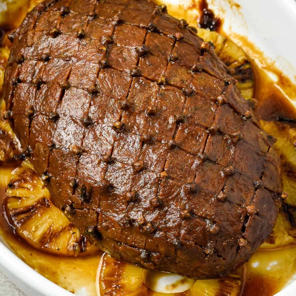Vegan Maple Glazed Ham Recipe from Vegan Fndly showcasing a delicious plant-based glazed ham dish on a plate
