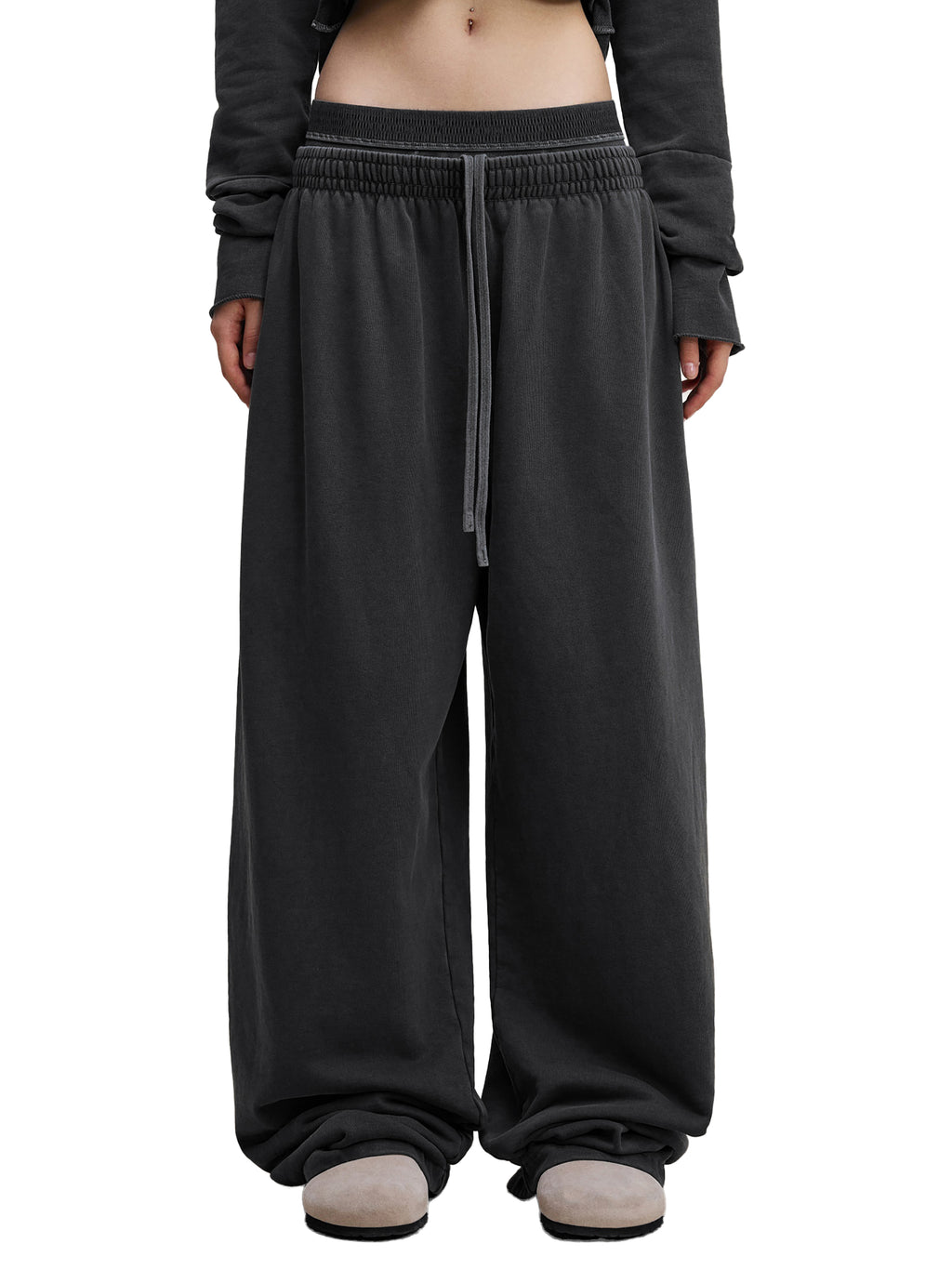 Vintage washed ODMPOD sweat pants with a relaxed fit, featuring a comfortable waistband and casual style.