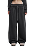 Vintage washed ODMPOD sweat pants with a relaxed fit, featuring a comfortable waistband and casual style.