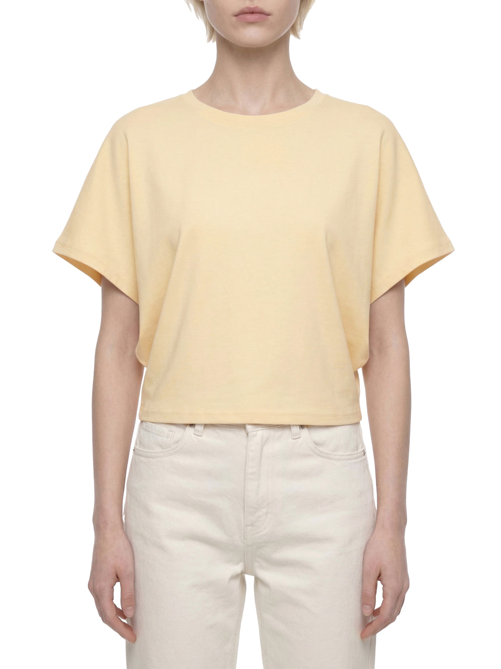 ODMPOD cropped dolman T-shirt displayed on a hanger, showcasing its relaxed fit and soft fabric in a casual fashion setting.