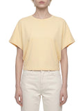 ODMPOD cropped dolman T-shirt displayed on a hanger, showcasing its relaxed fit and soft fabric in a casual fashion setting.