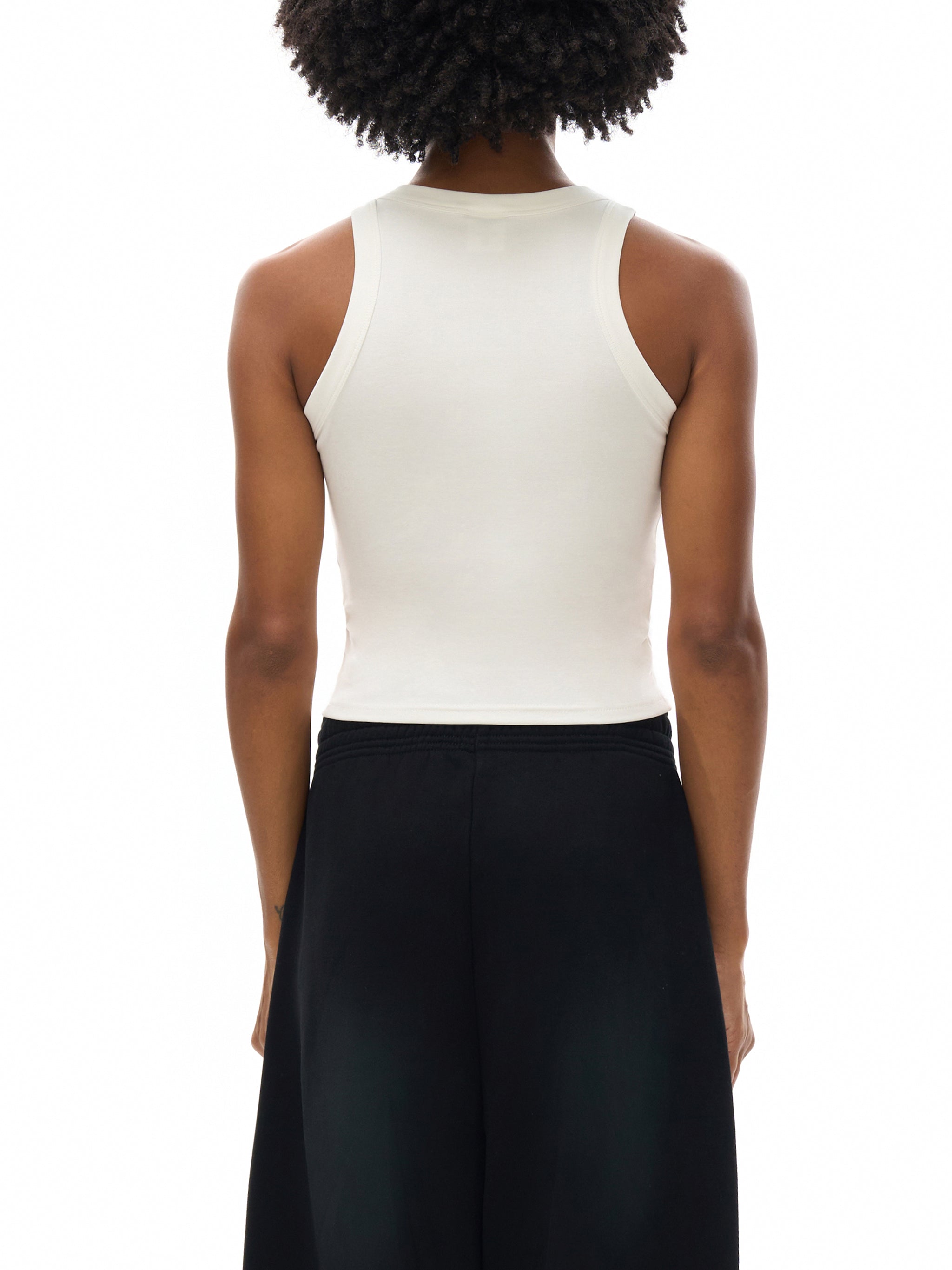 ODMPOD snow washed tank top, casual sleeveless shirt in soft, distressed fabric, displayed on a hanger.