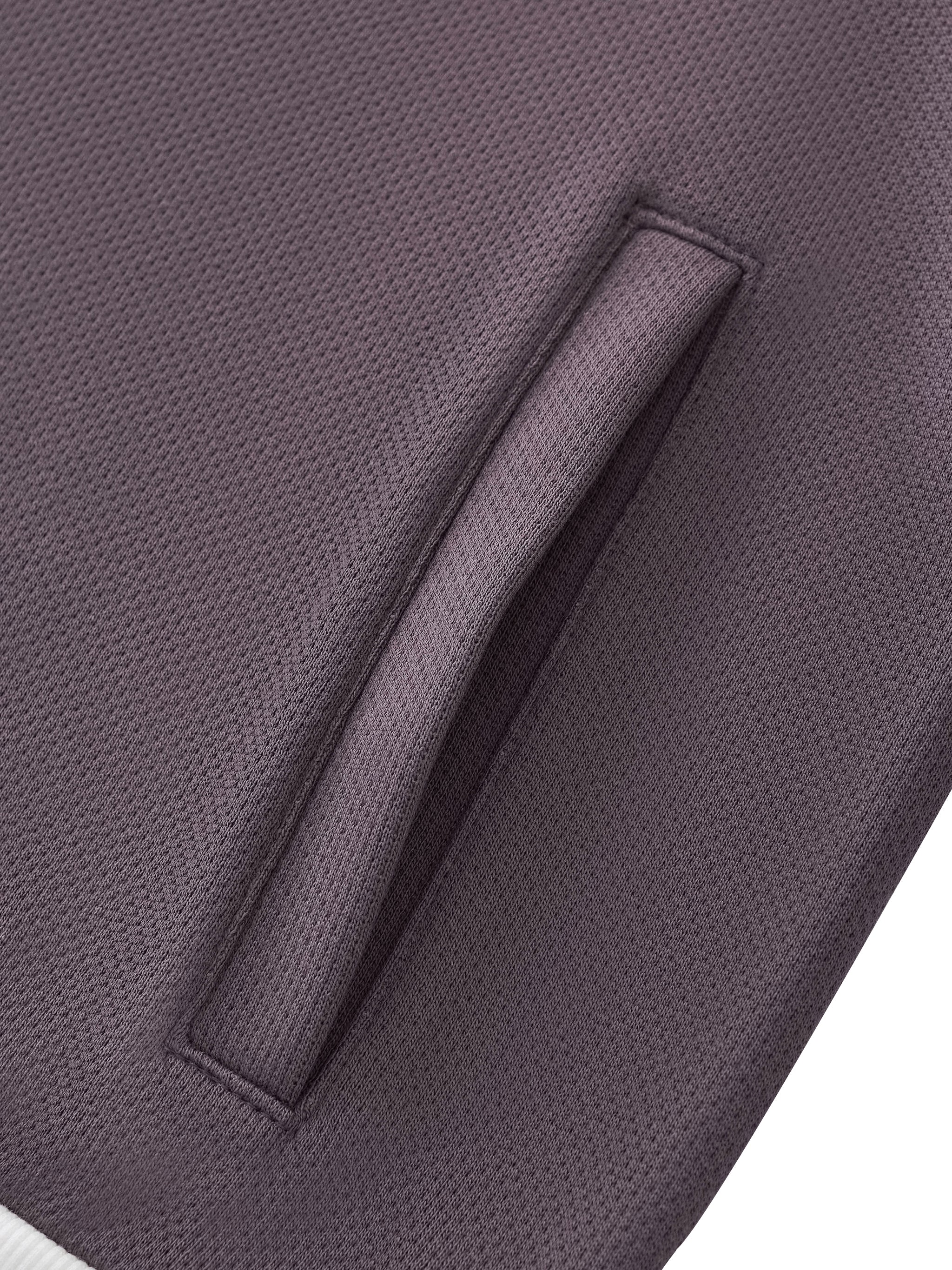 ODMPOD side stripe fleece cropped track jacket showing a stylish design with side stripe details and a cozy fleece texture.