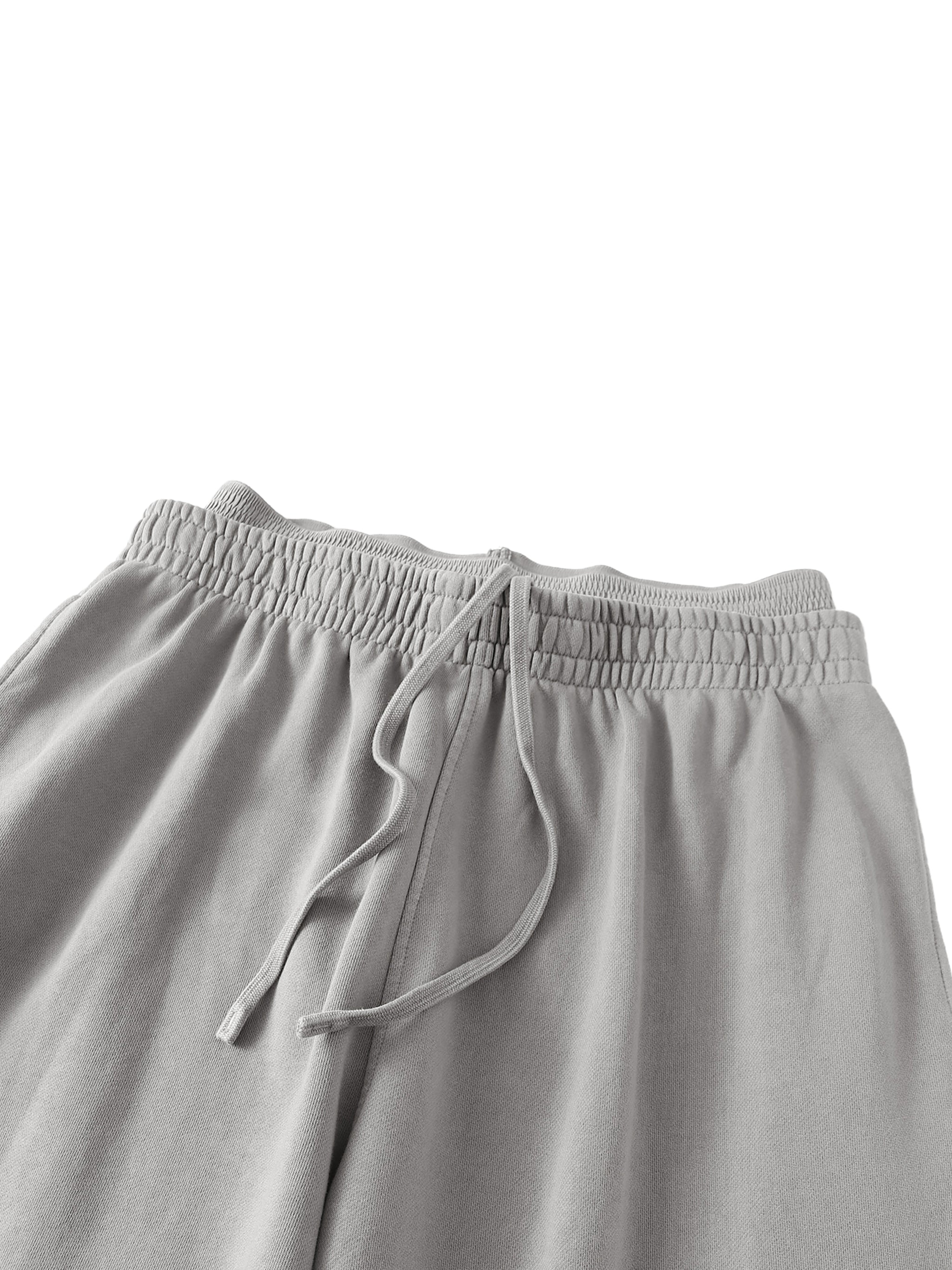 ODMPOD vintage washed sweatpants with a relaxed fit, shown in a soft, faded fabric with an elastic waistband and casual style.