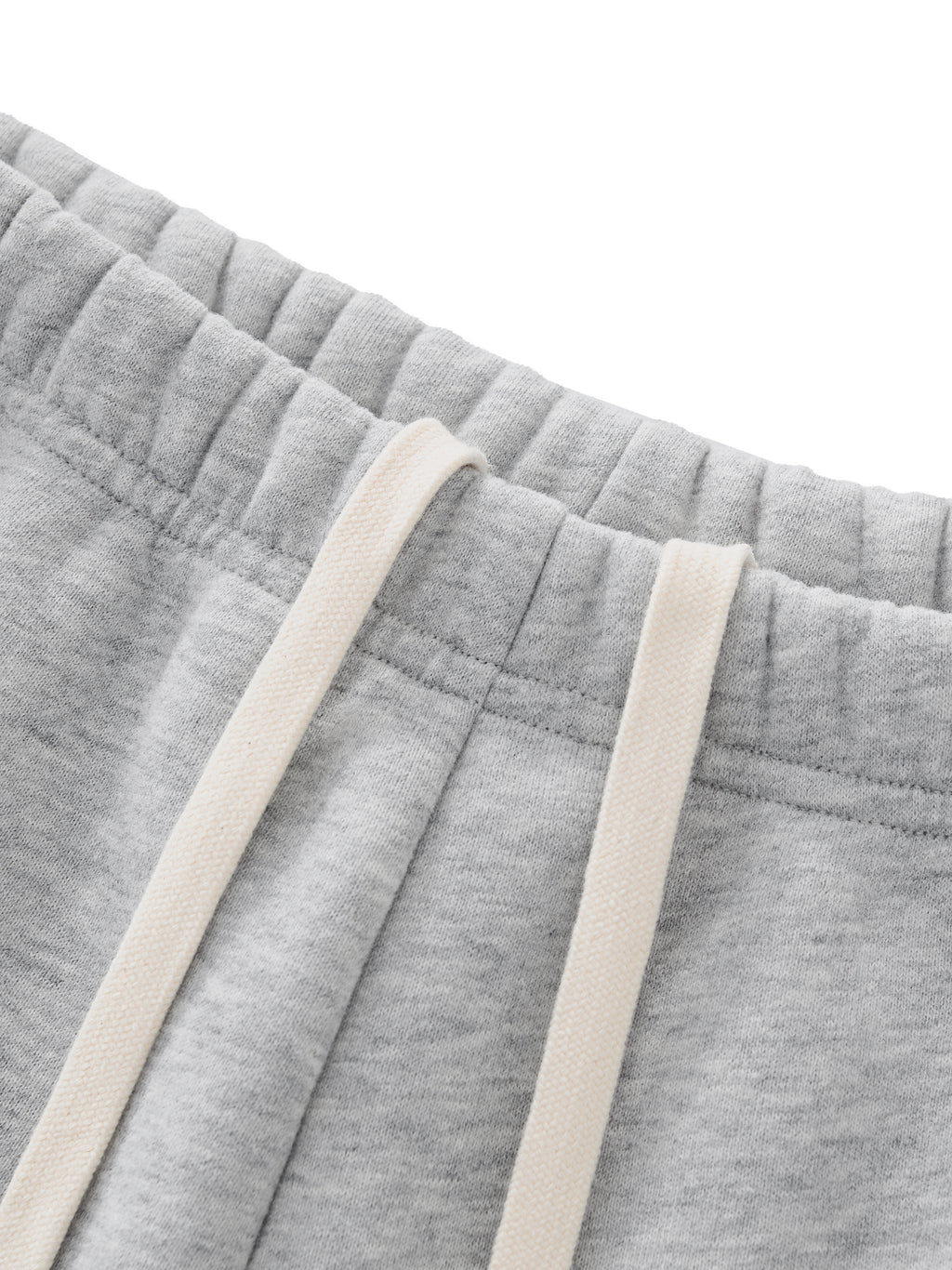 ODMPOD Essential fleece drawstring shorts, cozy casual shorts with elastic waistband and relaxed fit, suitable for lounging or active wear.