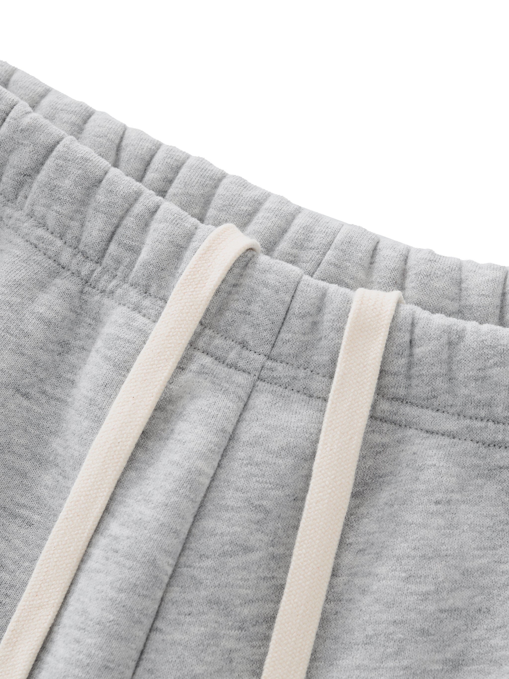 ODMPOD Essential fleece drawstring shorts, cozy casual shorts with elastic waistband and relaxed fit, suitable for lounging or active wear.