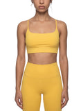 ODMPOD strappy criss cross yoga sports bra with supportive design and stylish straps, ideal for active workouts and exercise.