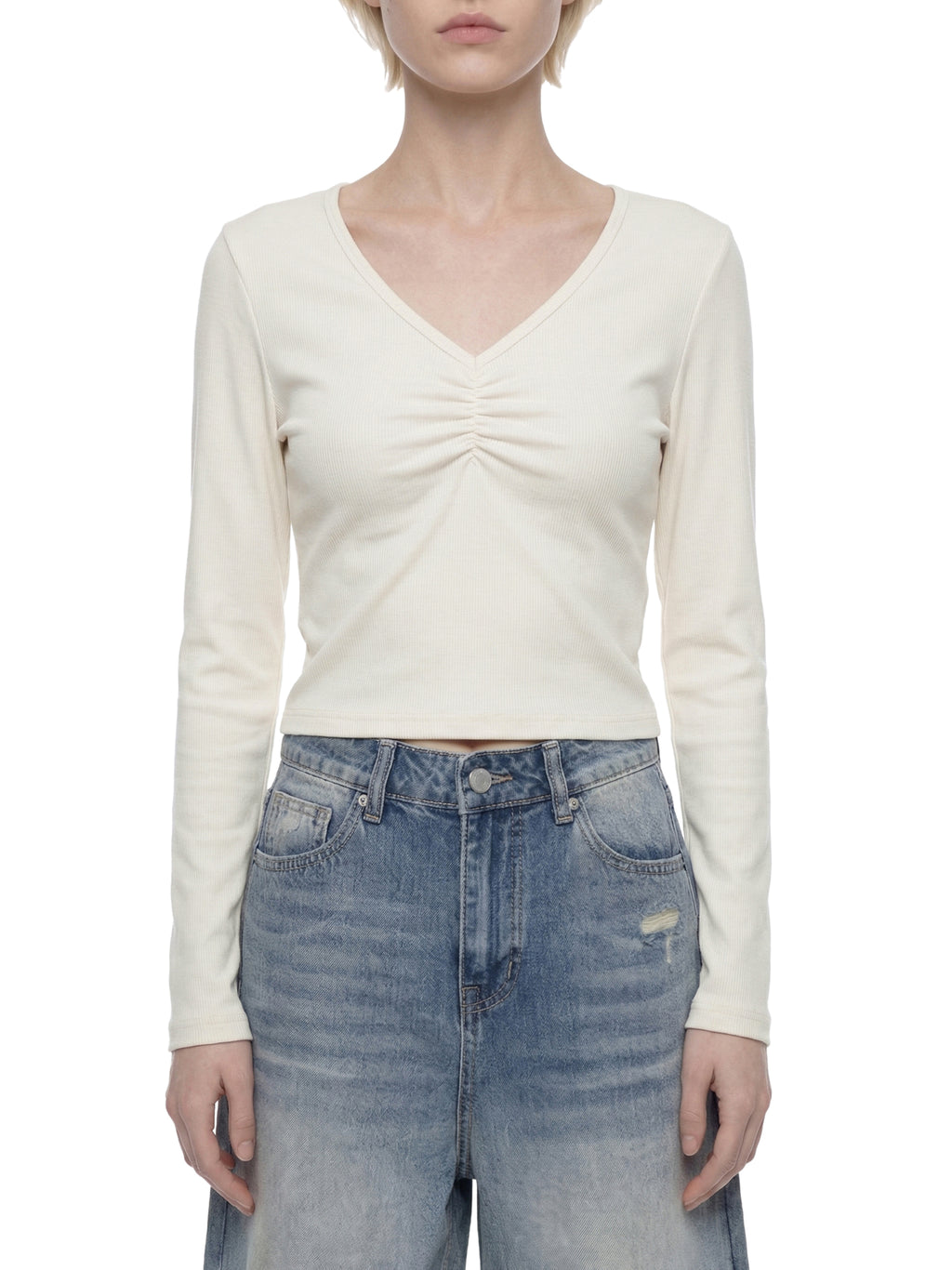 ODMPOD ruched long sleeve crop T-shirt featuring fitted design and stylish ruched detail in soft fabric.