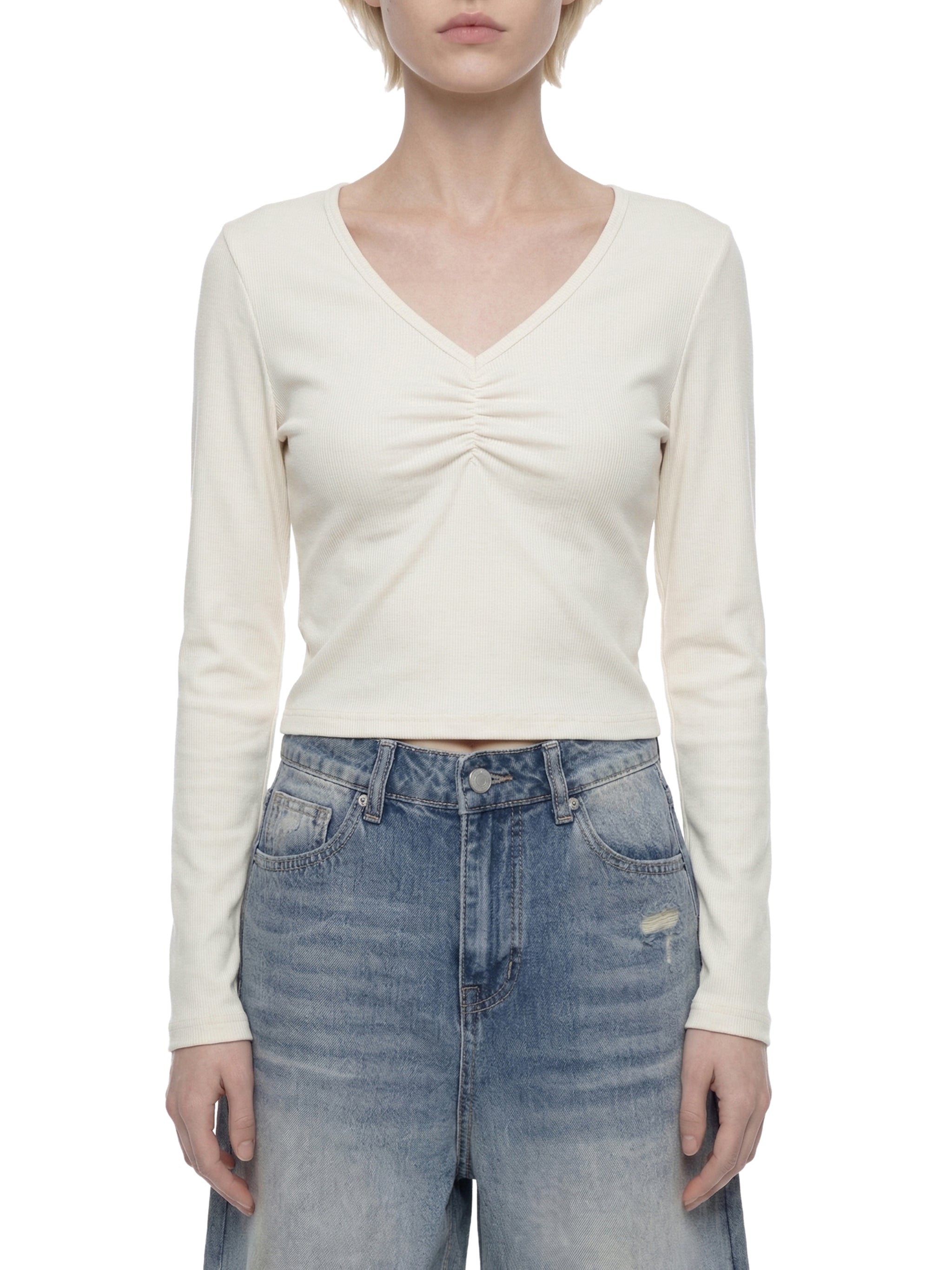 ODMPOD ruched long sleeve crop T-shirt featuring fitted design and stylish ruched detail in soft fabric.