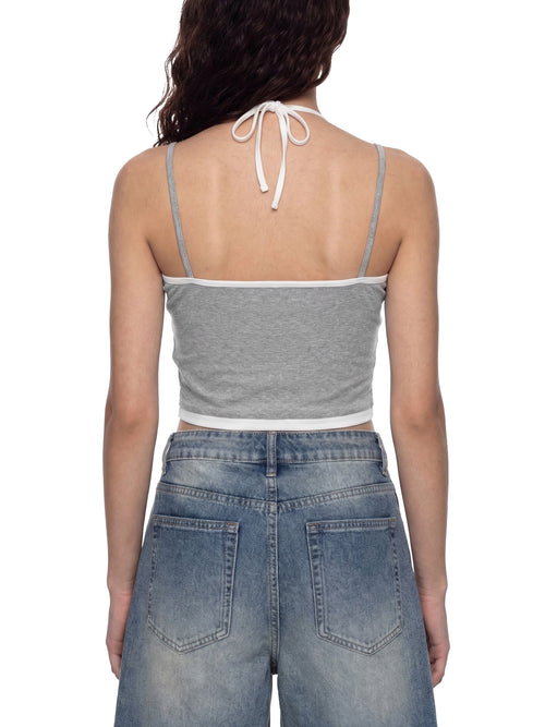 ODMPOD contrast binding halter tank top with stylish design, featuring a fitted silhouette and sleeveless style for casual wear.