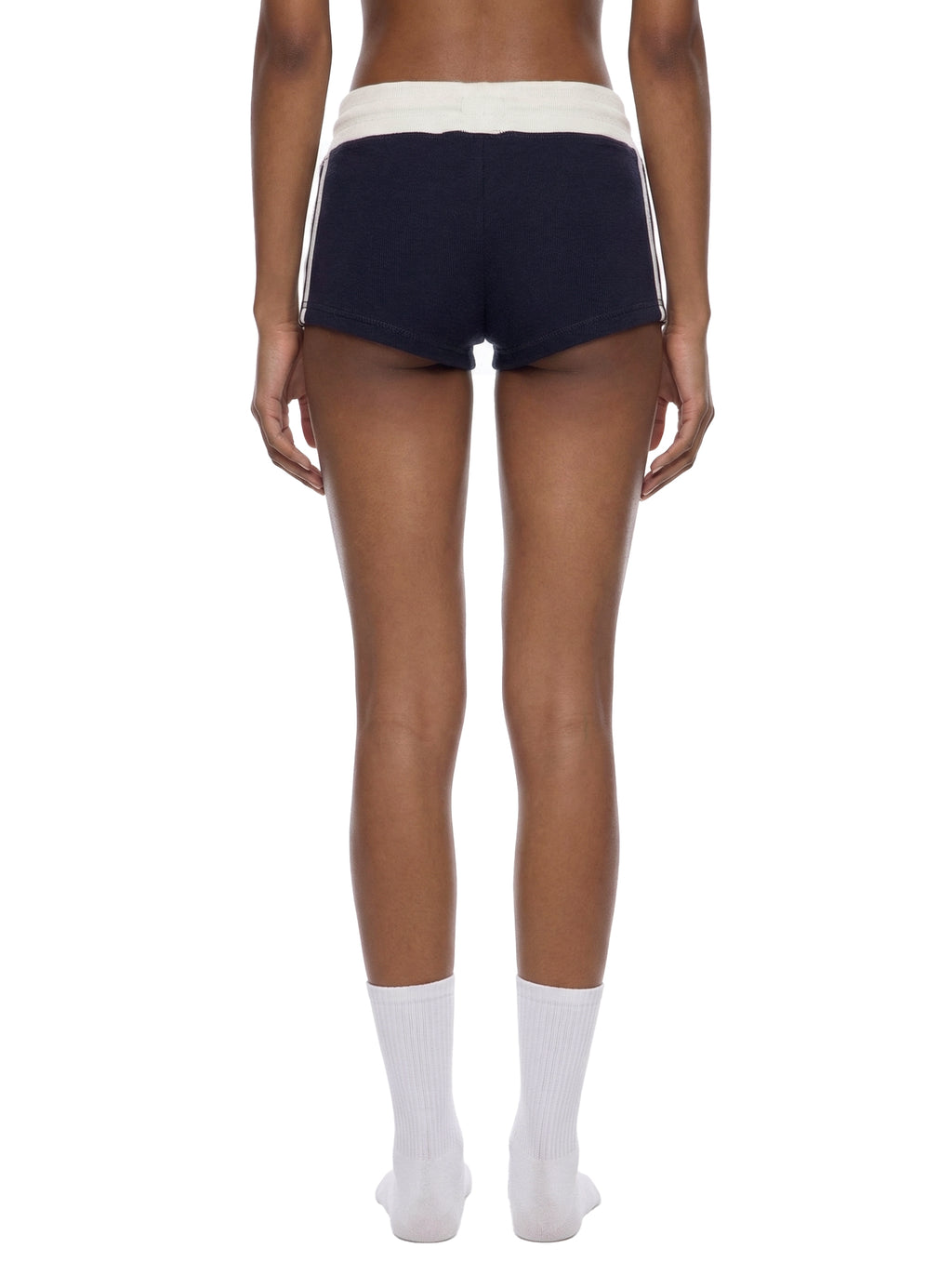ODMPOD contrast stripe track shorts showing a sporty design with black and white color blocking and comfortable elastic waistband.