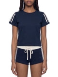 White ODMPOD varsity stripe T-shirt with sporty design and contrasting stripe details on the chest.
