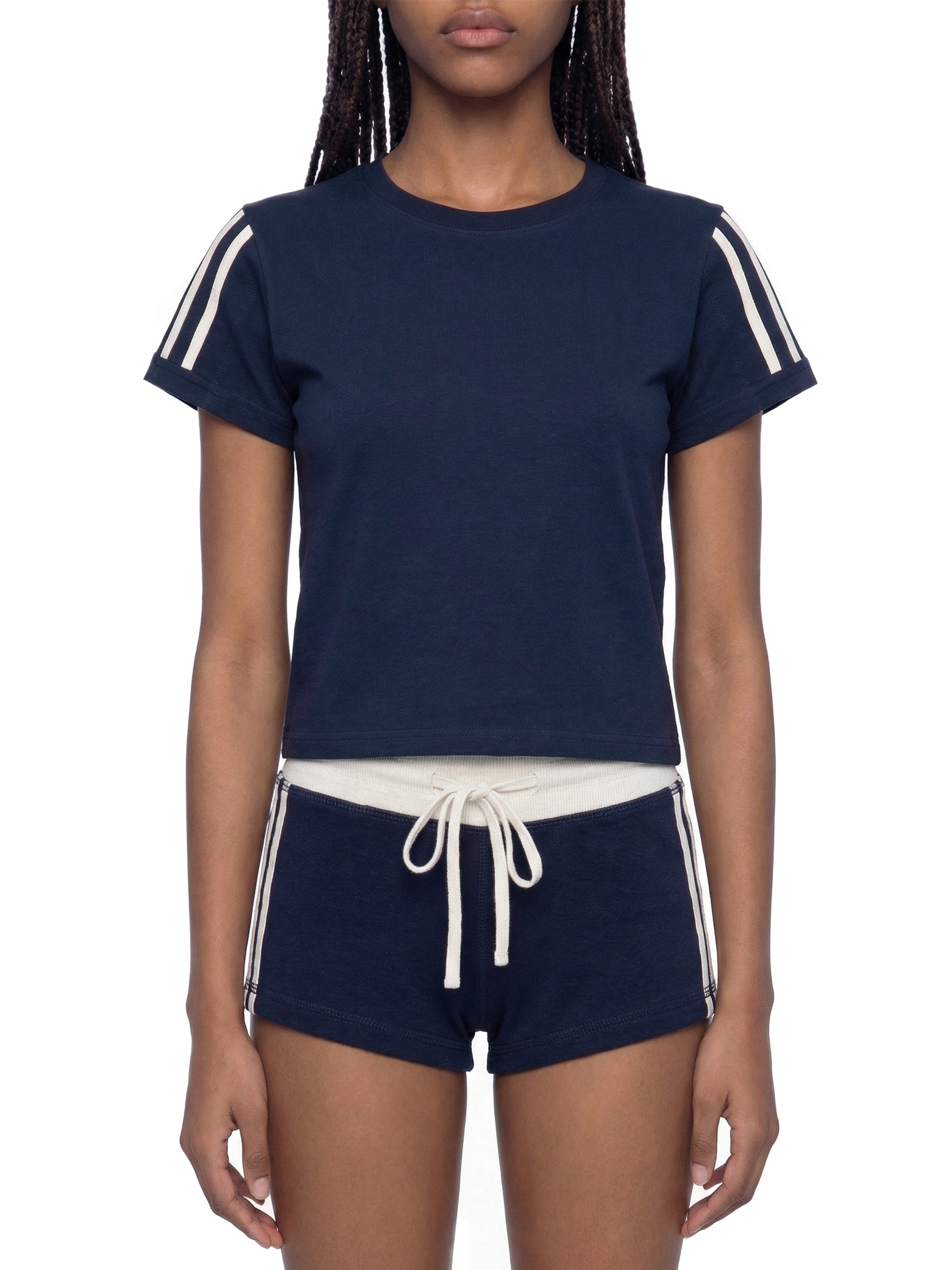 White ODMPOD varsity stripe T-shirt with sporty design and contrasting stripe details on the chest.