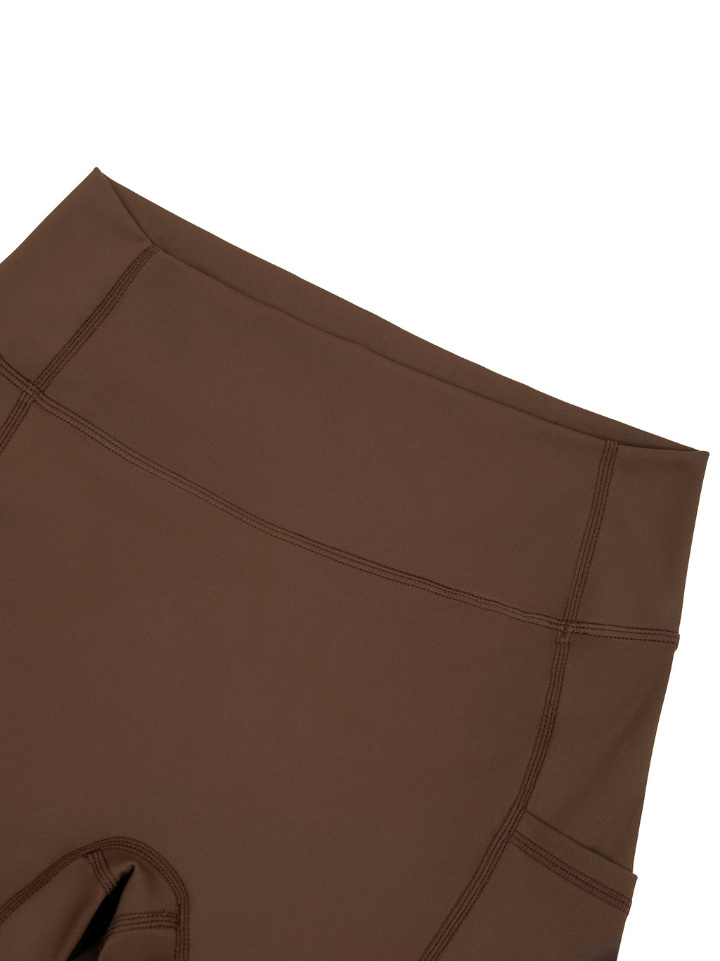 Black high-waisted biker shorts with front pockets from ODMPOD, shown on a model for casual and active wear.