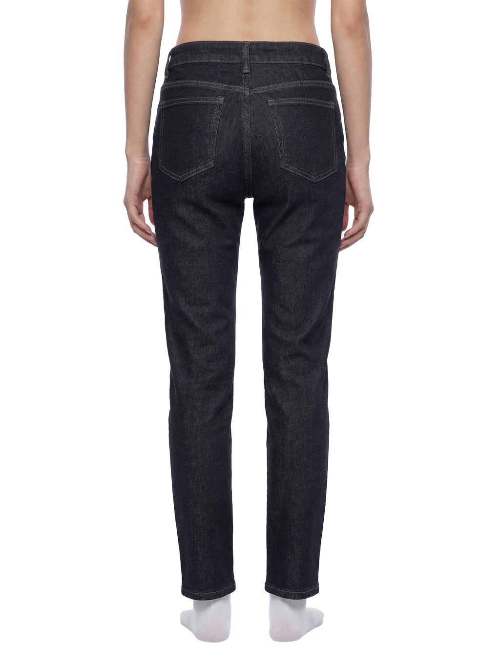 ODMPOD high-rise skinny jeans shown on a model, featuring a fitted silhouette and classic denim wash.