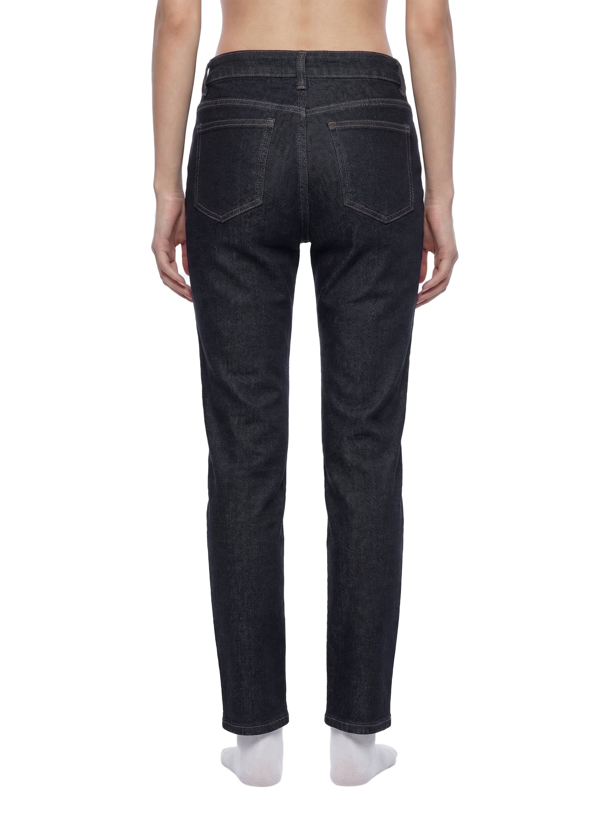ODMPOD high-rise skinny jeans shown on a model, featuring a fitted silhouette and classic denim wash.