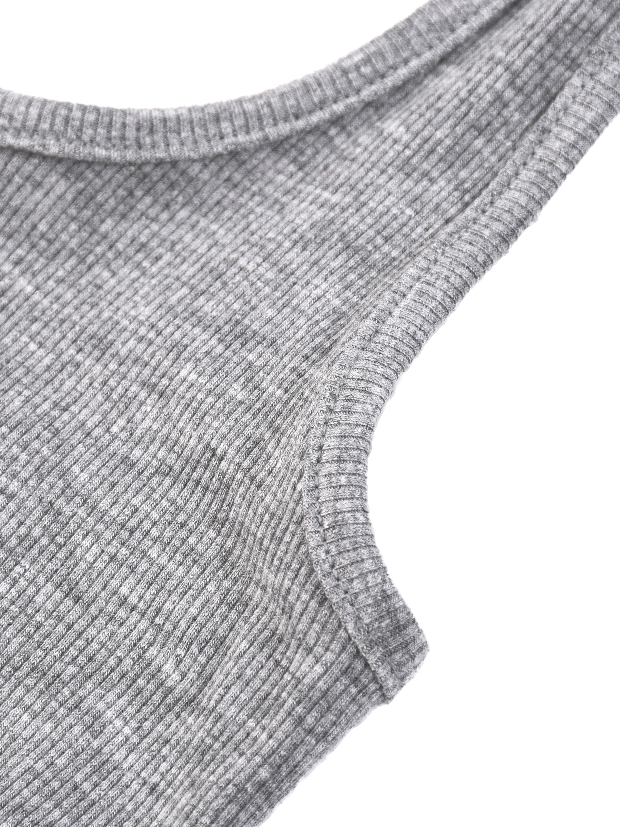 White ribbed Henley tank top by ODMPOD, close-up showing textured fabric and button details at the neckline.