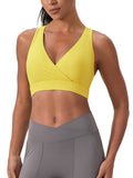 ODMPOD crossover V-neck sports bra in white with supportive design, shown on a mannequin for activewear.