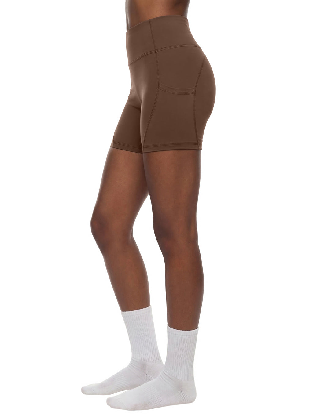 Black high-waisted biker shorts with front pockets by ODMPOD, shown laid flat on a white background.