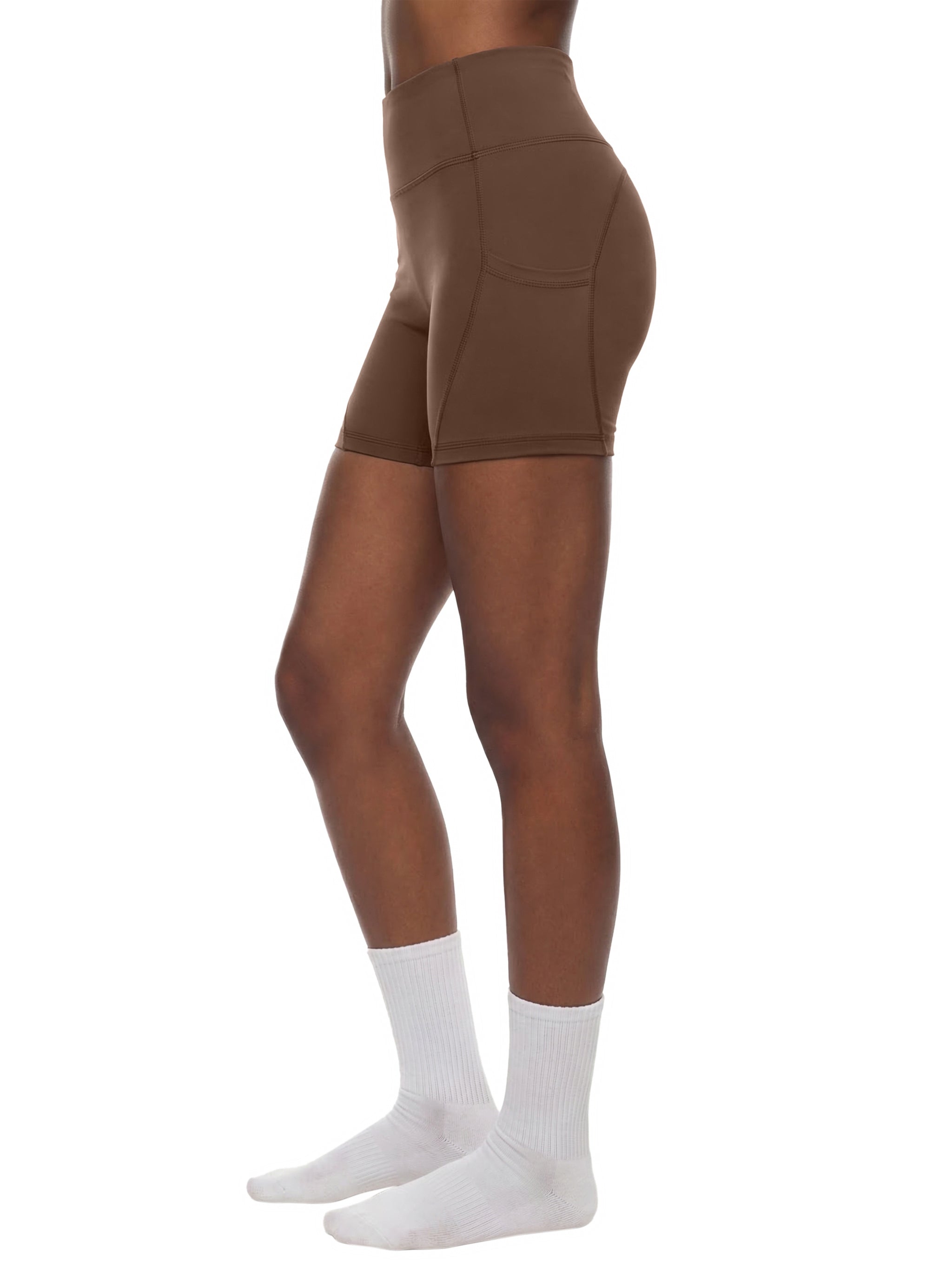 Black high-waisted biker shorts with front pockets by ODMPOD, shown laid flat on a white background.