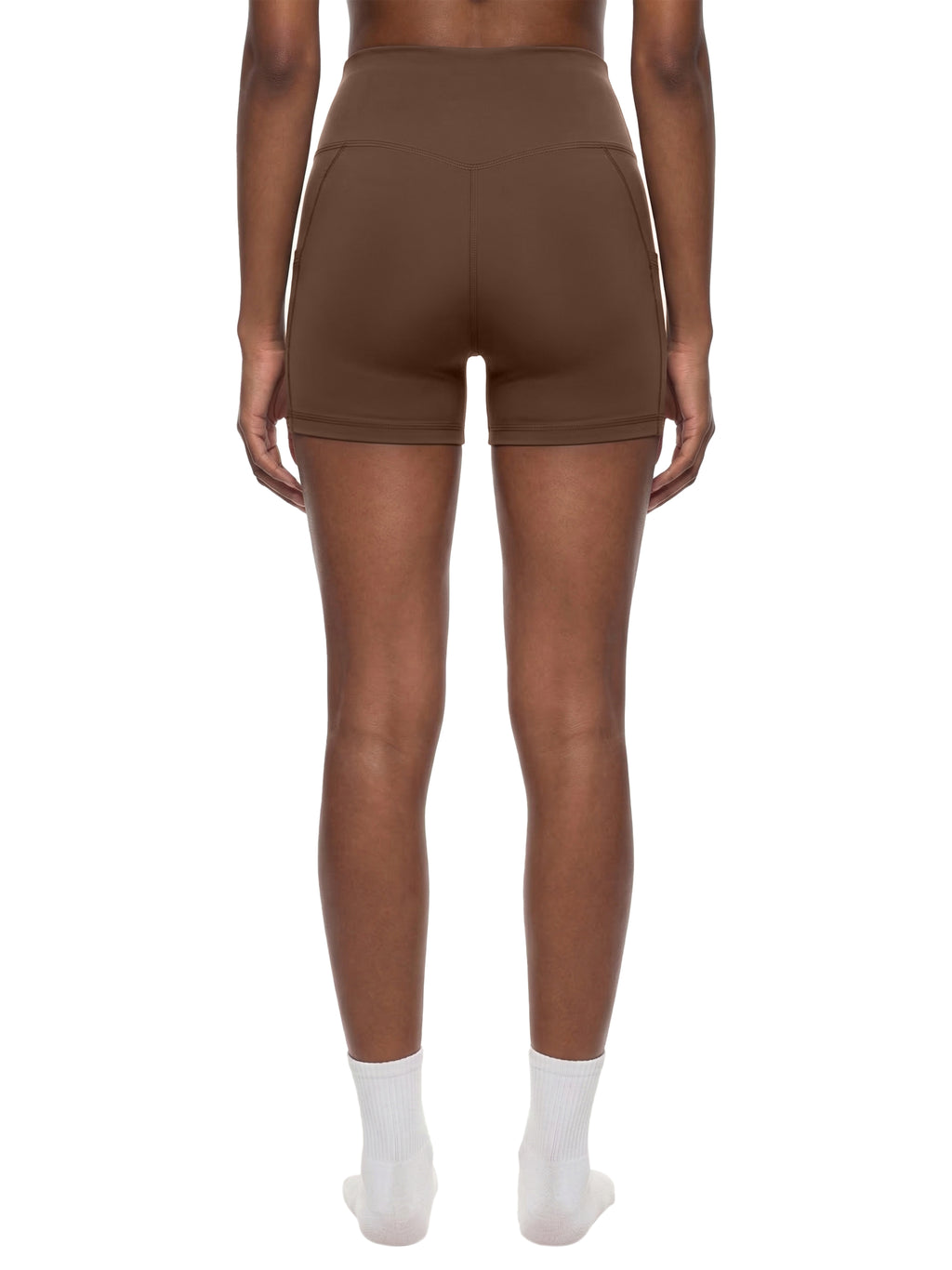 Black high-waisted pocket biker shorts by ODMPOD, featuring a snug fit and functional side pockets.