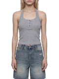 White ribbed Henley tank top by ODMPOD, close-up showing textured fabric and button details on the sleeveless shirt