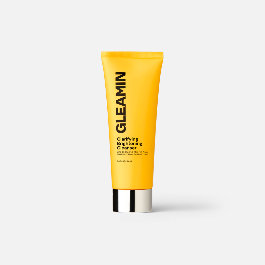 Gleamin Clarifying Brightening Facial Cleanser in a pump bottle, showing the white creamy cleanser with a clear cap.