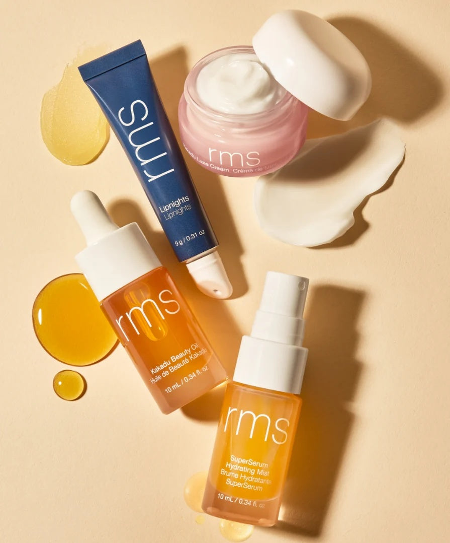 Nava Beauty RMS Beauty Skincare Secrets Travel Kit with skincare set including cleanser, moisturizer, and serum bottles.