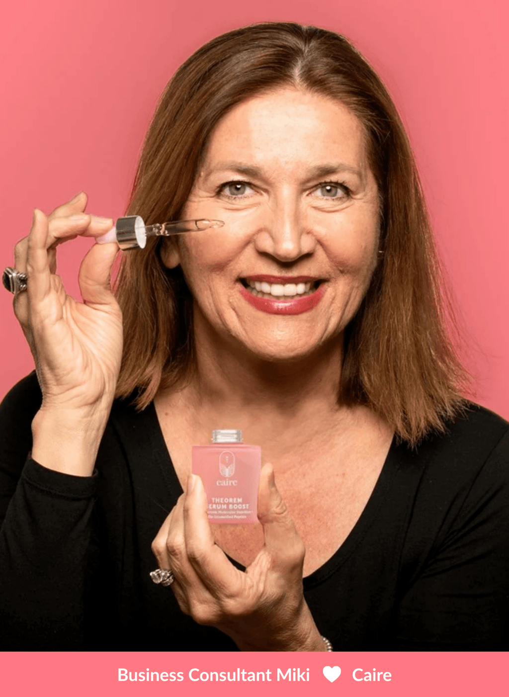 Caire Beauty Theorem Serum Boost bottle with dropper, clear serum inside, on a white background.